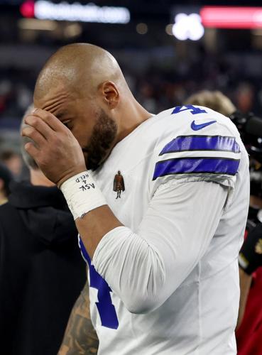 Dallas Cowboys quarterback Dak Prescott walks off the field after a 24-16 loss against the Tampa Bay Buccaneers at AT&T Stadium on Oct. 8, 2026, in Arlington, Texas.