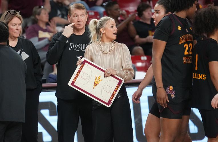 ASU Sun Devils head coach Molly Miller talks to her team on the sidelines as they play the Kansas State Wildcats at Desert Financial Arena in Tempe on Feb. 1, 2026.