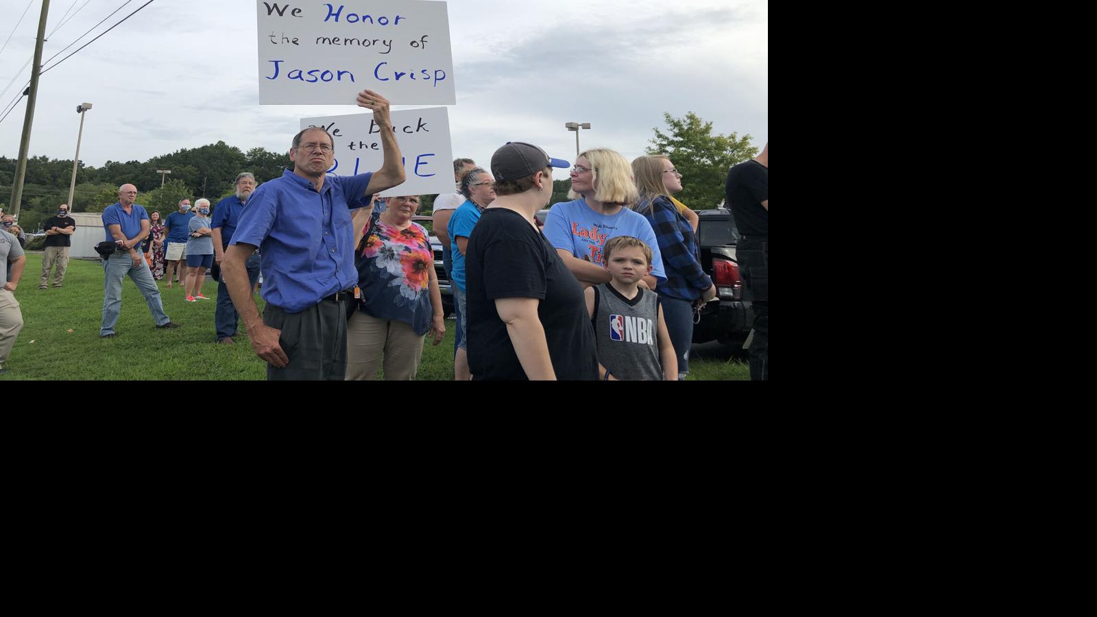 Hundreds of people gathered Thursday evening in front of the Lowe's Home Improvement store in Marion. They showed their support for Lowe's employee Garrett Crisp, who was reportedly informed by management that he could not wear a face mask supporting law enforcement. Video courtesy of Kendra Jackson Helms Crisp is the son of U.S.