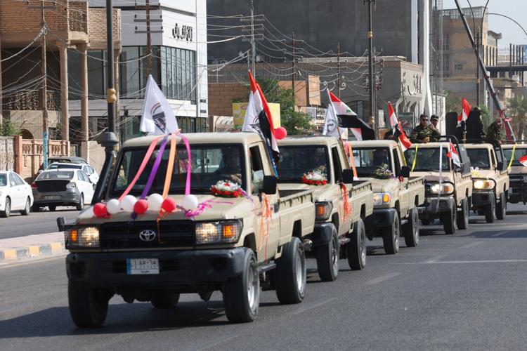 Celebrations after the withdrawal of US-led coalition forces from Iraq, in Najaf