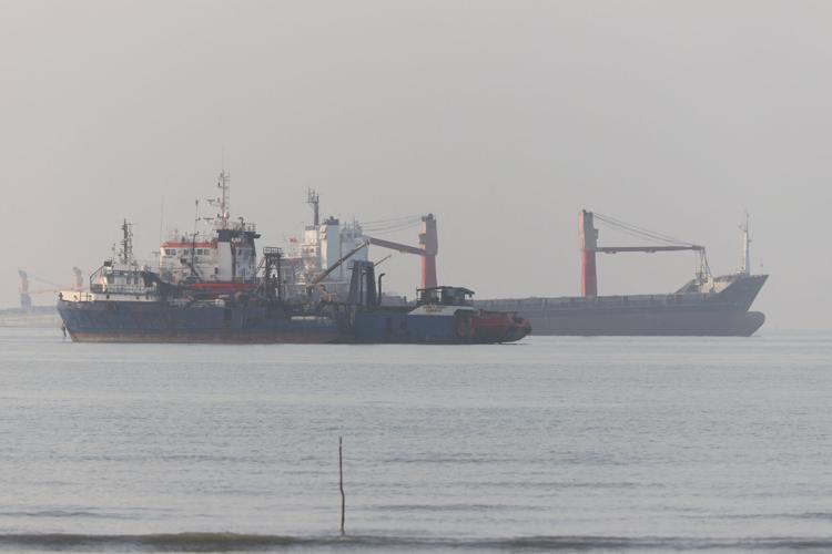 Vessels in the Strait of Hormuz are visible near the beach of Bandar Abbas