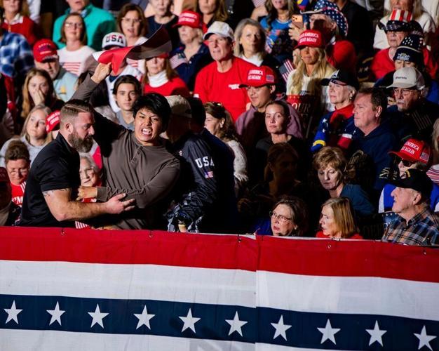 Security removes a heckler who shouted about the Epstein files during Vice President JD Vance’s remarks at Hyder Warehouse in Hendersonville on Oct. 19, 2026.