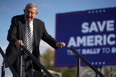 Lou Holtz leaves the stage during a rally with former U.S. President Donald Trump at the Florence Regional Airport on March 12, 2022, in Florence, South Carolina.