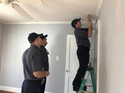 morganton firefighters install smoke detector