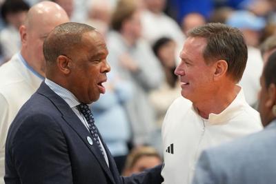 Nov 7, 2025; Chapel Hill, North Carolina, USA; North Carolina Tar Heels head coach Hubert Davis with Kansas Jayhawks head coach Bill Self before the game at Dean E. Smith Center. Mandatory Credit: Bob Donnan-Imagn Images