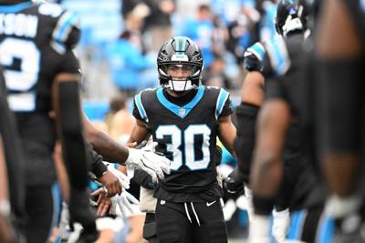 Dec 21, 2025; Charlotte, North Carolina, USA; Carolina Panthers running back Chuba Hubbard (30)  runs on to the field before the game at Bank of America Stadium. Mandatory Credit: Bob Donnan-Imagn Images