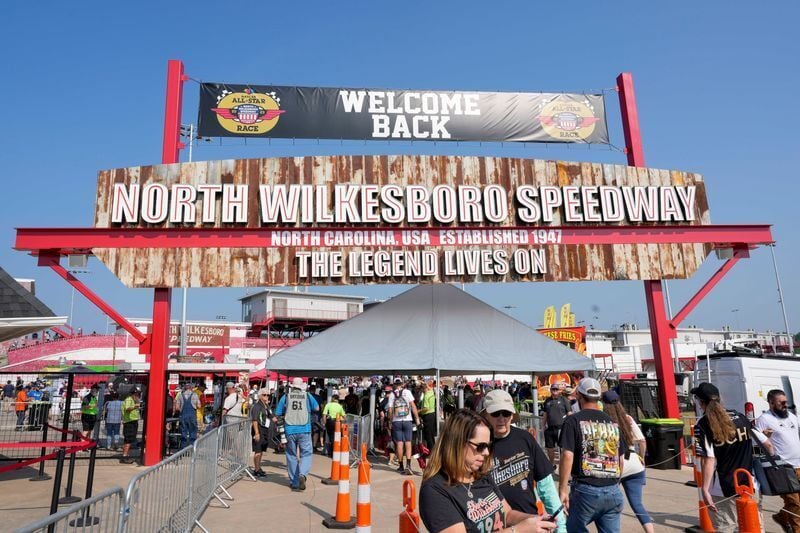 Fans stream into the entrance of North Wilkesboro Speedway for NASCAR All-Star Race weekend on May 21, 2023.