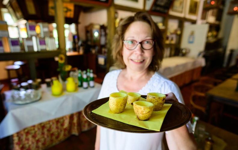 Ilka Fröhlich offers potato schnaps, served in tumblers made of spuds.