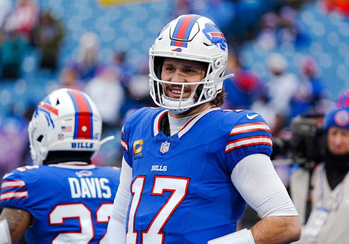 Buffalo Bills quarterback Josh Allen (17) smiles at something someone said before the Buffalo Bills wild card game against the Denver Broncos at Highmark Stadium in Orchard Park on Jan. 12, 2025.