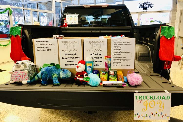 Jim Cook Chevrolet collecting toys, household items