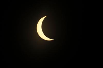 At 3:09 p.m., the solar eclipse goes to maximum eclipse during the practice round of the 2024 Masters Tournament at Augusta National Golf Club, Monday, April 8, 2024, in Augusta, Georgia.