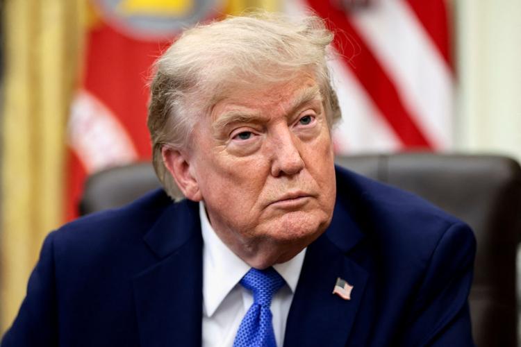U.S. President Donald Trump signs executive orders at the Oval Office in Washington