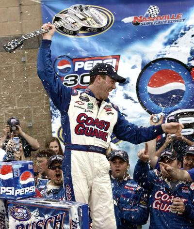 Driver Kevin Harvick celebrates his victory in the NASCAR's Pepsi 300 Busch race at Nashville Superspeedway in Gladeville,