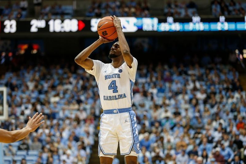 Jan 25, 2020; Chapel Hill, North Carolina, USA; North Carolina Tar Heels guard Brandon Robinson (4) shoots against the Miami Hurricanes during the second half at Dean E. Smith Center. The North Carolina Tar Heels won 94-71. Mandatory Credit: Nell Redmon...