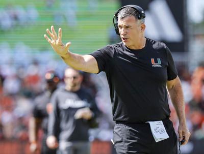 Miami Hurricanes head coach Mario Cristobal signals from the field during UM’ s spring football game at Cobb Stadium on the University of Miami campus in Coral Gables, Fla., on Saturday, April 18, 2026.