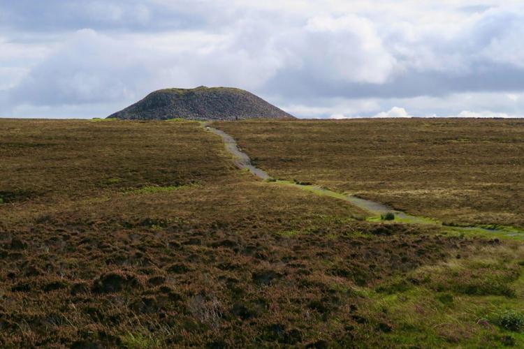 Knocknarea stands alone on the horizon, a monolith that is home to an ancient stone tomb where, according to legend, the warrior queen Maeve is buried.