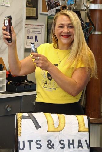 Molly Prescott poses inside her shop, Faded Cuts & Shaves, on South South Street in Gastonia Monday morning, Aug. 24, 2026.