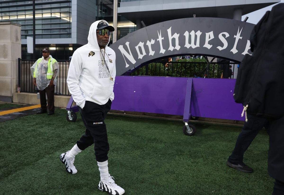 Colorado head football coach Deion Sanders enters the field for a game against Northwestern at Martin Stadium on Saturday, Sept. 19, 2026, in Evanston, Ill..