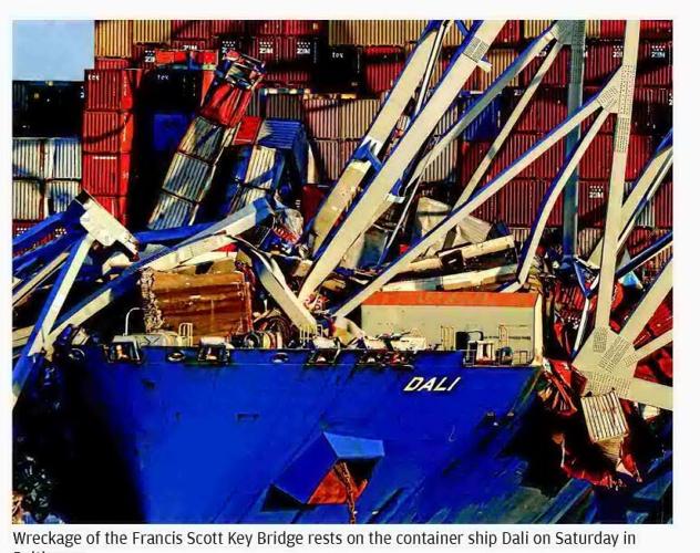 CREWS REMOVING COLLAPSED BRIDGE