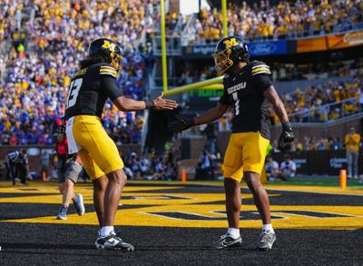 Missouri's Austin Simmons and Donovan Olugbode celebrate after a first-half touchdown against Florida at Faurot Field at Memorial Stadium on Saturday, Oct. 3, 2026, in Columbia, Missouri.