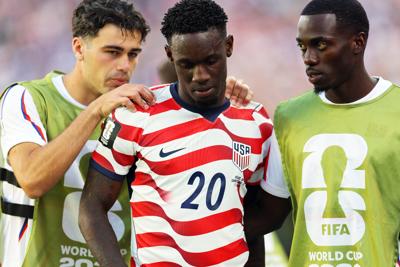 July 1, 2026; Santa Clara, California, U.S.; Folarin Balogun of the U.S. is consoled by Giovanni Reyna and Timothy Weah after receiving a red card.  Mandatory Credit: Carlos Barria-Reuters via Imagn Images