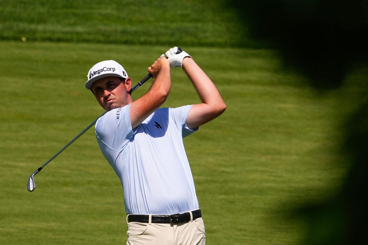 J.T. Poston prepares to hit the ball on the 11th fairway during the final round of the Memorial Tournament at Muirfield Village