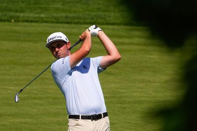 J.T. Poston prepares to hit the ball on the 11th fairway during the final round of the Memorial Tournament at Muirfield Village