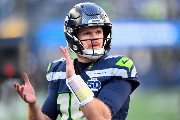 Jan 25, 2026; Seattle, WA, USA; Seattle Seahawks quarterback Sam Darnold (14) looks on before the 2026 NFC Championship Game against the Los Angeles Rams at Lumen Field. Mandatory Credit: Steven Bisig-Imagn Images