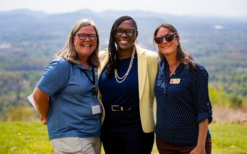 Buncombe County Parks and Recreation Director Allison Dains (left), Buncombe County Manager Avril Pinder (center) and Michelle Pugliese, land protection director at Southern Appalachian Highlands Conservancy, pose for a photo at Deaverview Mountain in A...
