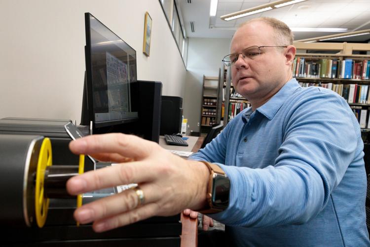 John Collins in library