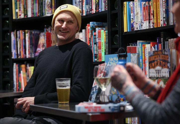 Librarian and author Jarrett Dapier sits for a conversation with Chicago Teachers Union project organizer and former teacher Nora Flanagan about his graphic novel, "Wake Now in the Fire," at The Book Cellar, 4736 N. Lincoln Ave., Tuesday, Feb. 3, 2026, ...