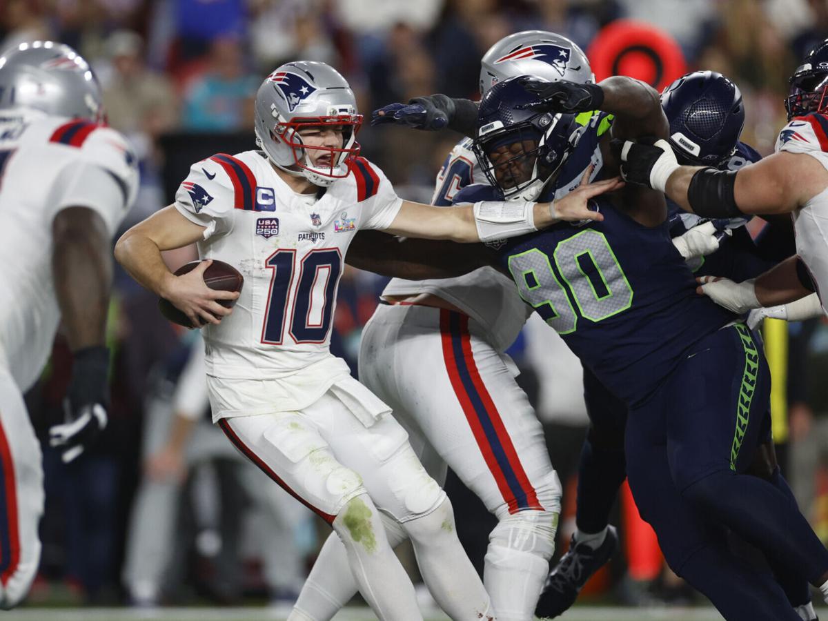 New England Patriots quarterback Drake Maye is tackled by Seattle Seahawks' Jarran Reed in the third quarter of Super Bowl LX at Levi's Stadium in Santa Clara, California, on Sunday, Feb. 8, 2026.