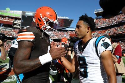 Sep 27, 2026; Cleveland, Ohio, USA;  Cleveland Browns quarterback Deshaun Watson (4) shakes hands with Carolina Panthers quarterback Bryce Young (9) after the game at Huntington Bank Field.  Mandatory Credit: Scott Galvin-Imagn Images
