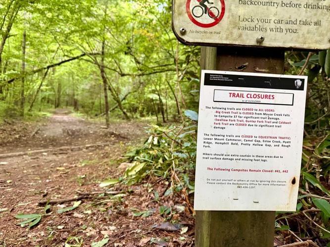 Signs in the Great Smoky Mountains National Park still warn of dangerous conditions on some trails.