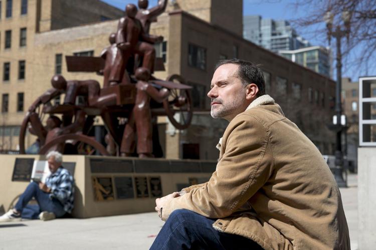 Zayd Ayers Dohrn, a playwright and Northwestern professor, sits near the Haymarket Memorial in the West Loop on April 9, 2026. Dohrn, the son of Bill Ayers and Bernardine Dorhn, the longtime Hyde Parkers and leaders of the militant activist group The We...