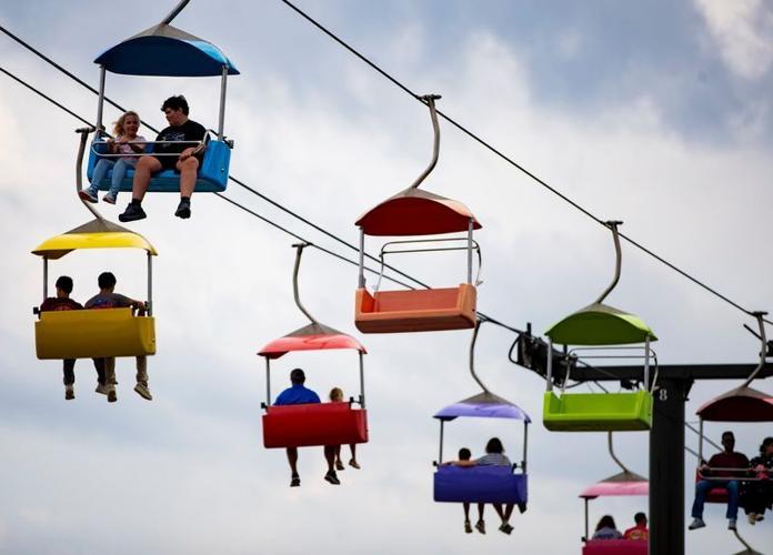 Fairgoers ride a gondola over the NC Mountain State Fair in Fletcher, Sept. 6, 2025.
