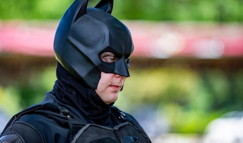 Samuel David Daniels, known as the Burnsville Batman, listens during an interview with the Asheville Citizen Times at Burnsville Town Square on July 9, 2026, in Burnsville.