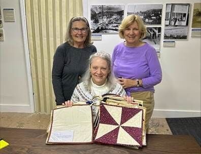 Quilters guild give to museum.jpg