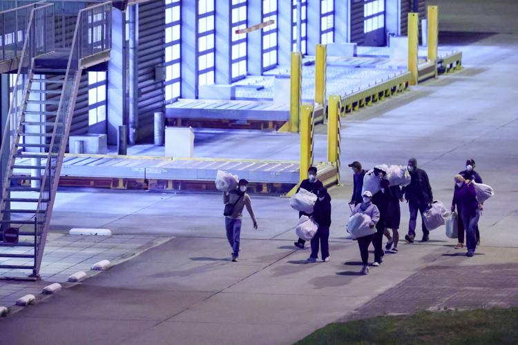 FILE PHOTO: Passengers evacuated from the cruise ship MV Hondius, which was affected by a hantavirus outbreak, arrive at the Eindhoven Air Base