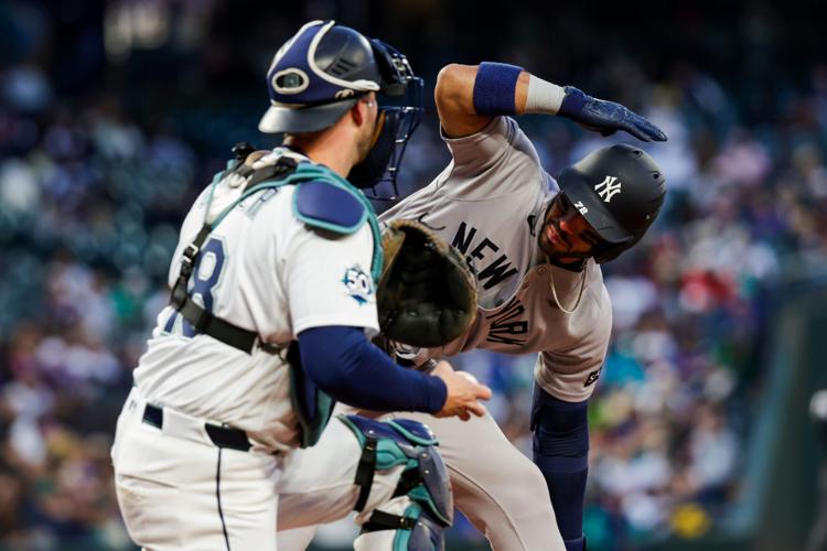 Mar 30, 2026; Seattle, Washington, USA; New York Yankees shortstop Jose Caballero (72) signals for an ABS challenge on a pitch by the Seattle Mariners during the third inning at T-Mobile Park. The strike was overturned and Caballero walked. Mandatory Cr...