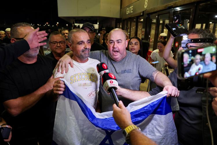 Passengers from a FlyDubai flight to Israel from United Arab Emirates that was diverted to Saudi Arabia after an emergency signal arrive at Ben Gurion International Airport