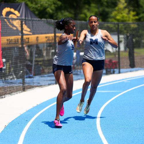 Marietta's Akhaila MaKenna passes the baton to Camille Brown in the GHSA 7A 4x200M State Finals. SPECIAL//Leah Watson