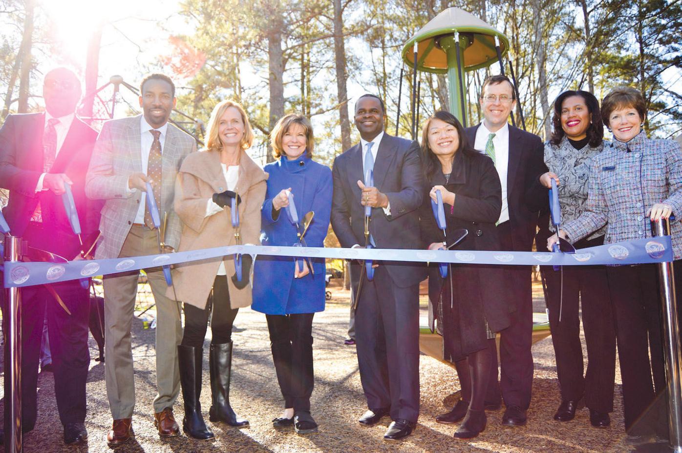 Full playground opens 1 group at ribbon-cutting ceremony