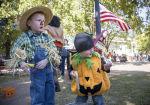 10-17-15 --HARVEST FEST-- Four-year-old Jackson Goodwin, left, and his two-year-old Jacob pick out prizes after winning a game during the 39th annual Harvest Fest on the Marietta Square. / Staff-Kathryn Ingall