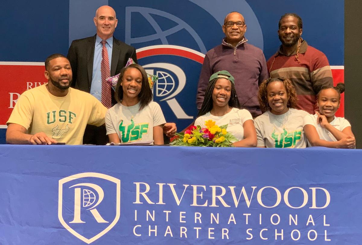 121819_MNS_full_Riverwood_signees_007 Jadaja Baxter Jimmy Baxter Jordyn Baxter Monica Baxter Michael Mezzio Isaac Seals Larry Harris