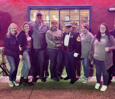 LOCAL Realty surprises owners of Woodstock's Semper Fi Bar & Grill, Ralph and Carrie Roeger, with the November LOCAL Hero award at their annual Marine Corps' birthday celebration event.