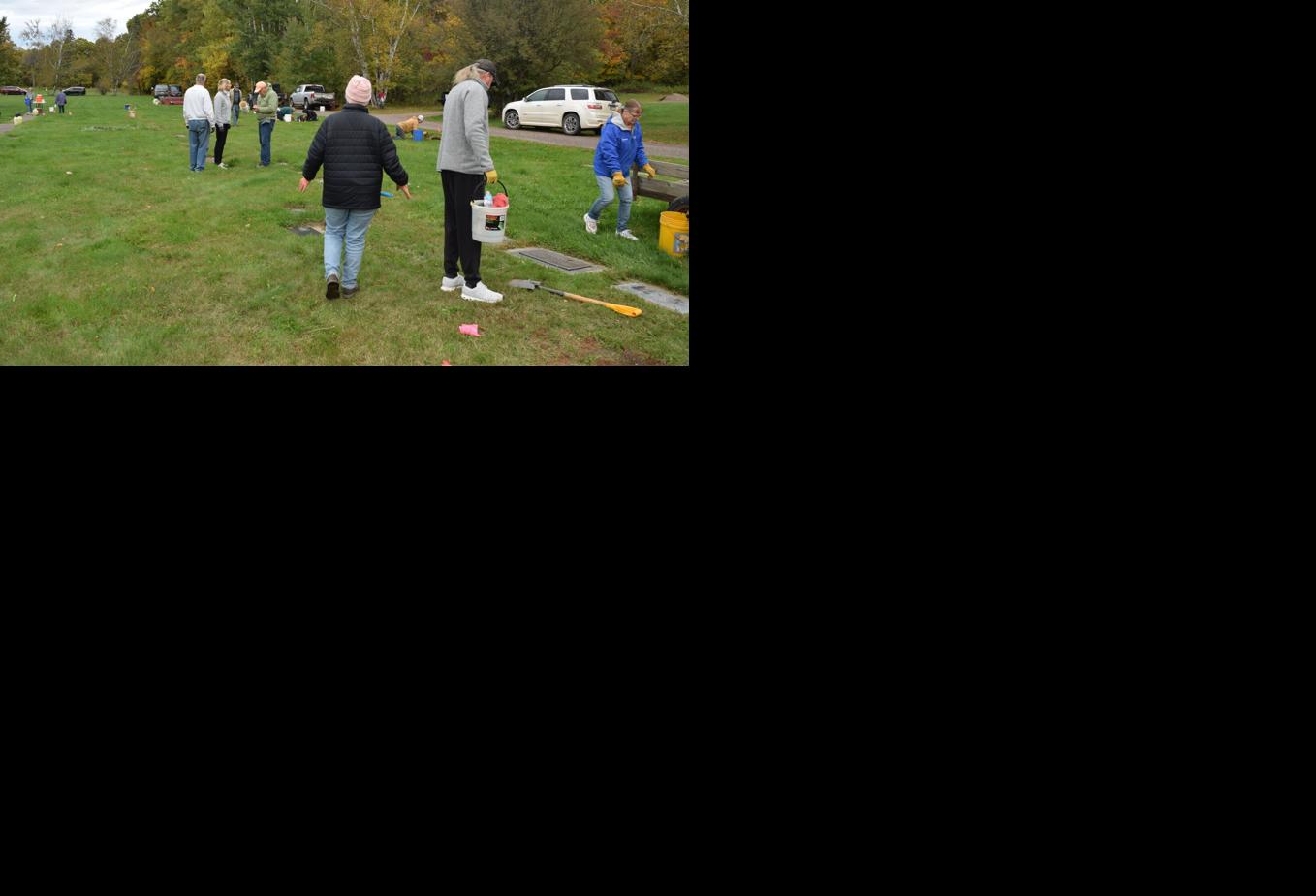 Maintaining graves means honoring memories in cemetery clean-up event ...