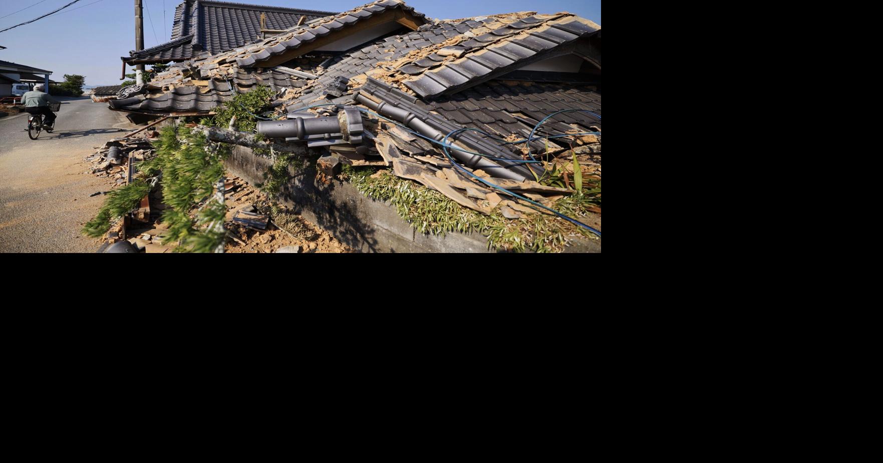 Prime minister visits quake-hit southern Japan as cleanup begins in intense heat