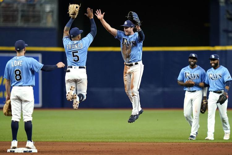 Tampa Bay Rays shortstop Wander Franco fields a ground ball out