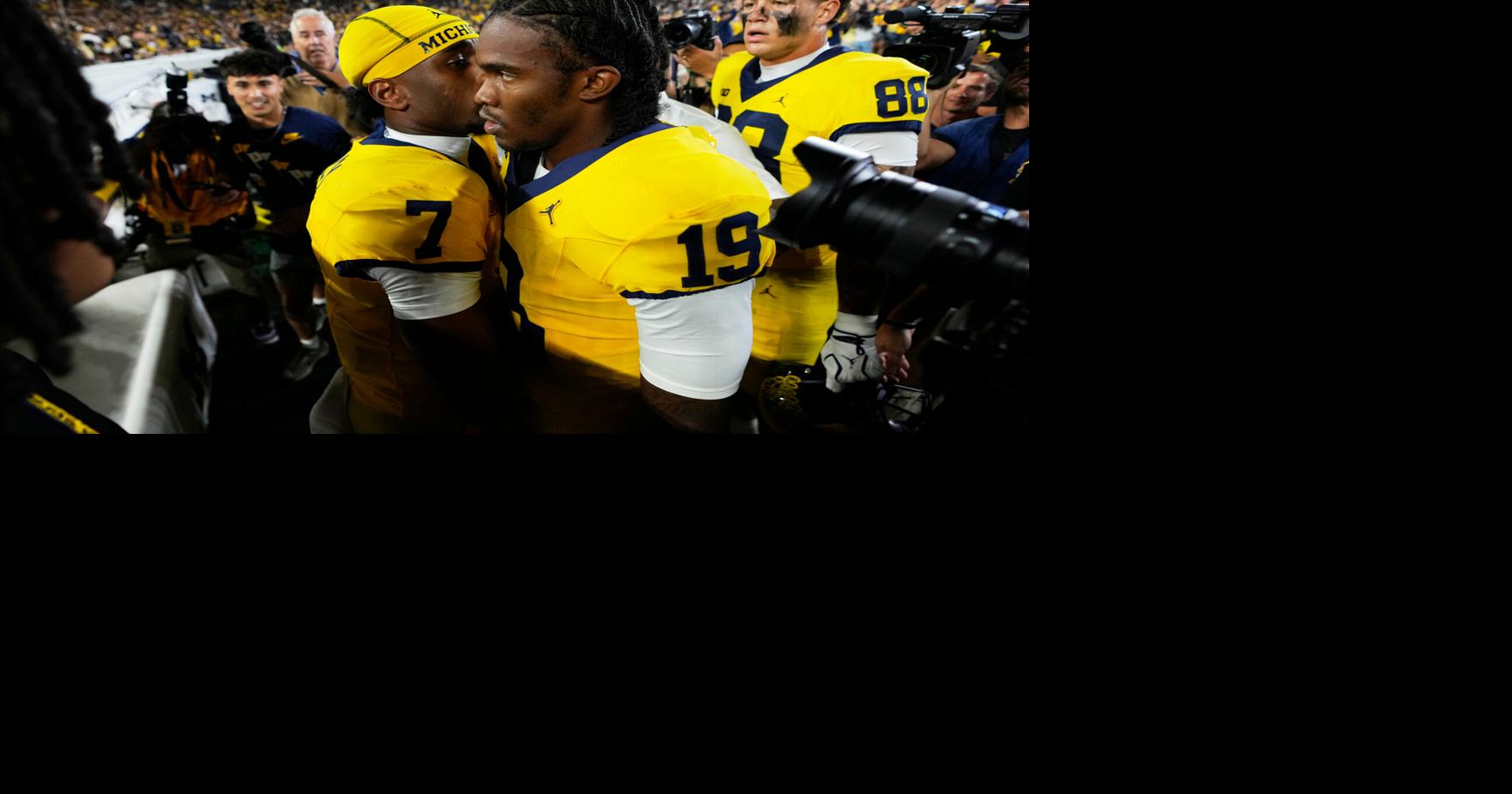 Michigan wins but it costs them a spot in the Top 25